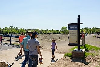 People look for diamonds in the field at Crater of Diamonds State Park in Murfreesboro, Arkansas. Editorial credit: Kimberly Boyles / Shutterstock.com