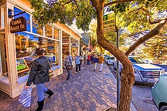 People shopping on the main street in Carmel, California via oliver de la haye / iStock.com