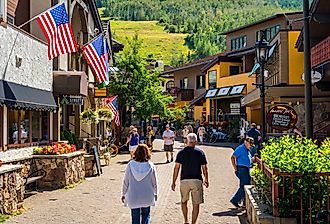 People walking in downtown Vail, Colorado in the summer. Image credit Alex Cimbal via Shutterstock