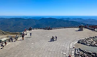 Tourists standing on the observation deck at the summit of Mount Washington. Editorial credit: travelview / Shutterstock.com