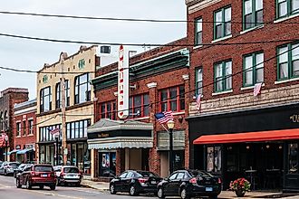 Westerly, Rhode Island: High Street with colourful buildings and a few people. via peeterv / iStock.com