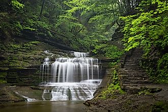 Waterfall cascades through Buttermilk Falls State Park, Ithaca, New York