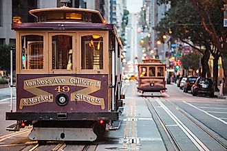 A cable car travels California, Van Ness and Market Streets. Via Shutterstock / Connect Images-Curated