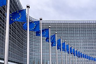 European Union flags in front of the European Commission headquarters in Brussels, Belgium. Editorial credit: Mounir Taha / Shutterstock.com
