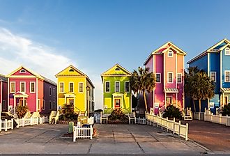 Colorful beachfront homes in St. George Island. Image credit H.J. Herrera via Shutterstock.