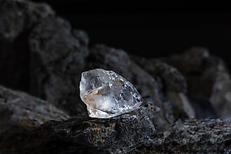 Natural rough diamonds on a pile of rocs close up photography.