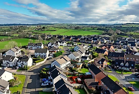 Aerial view of residential housing and businesses in Antrim, Northern Ireland.