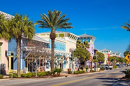 Colorful storefronts in downtown Panama City Beach, Florida, USA on a clear day.