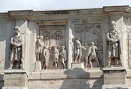 Rome, two left relief panels of the south attic of the triumphal Arch of Constantine, depicting an enemy chieftain before the emperor, and a scene with other prisoners. Image credit MonikaKL via Shutterstock