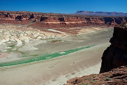 The Colorado River and the dried up arm of Lake Powell at Hite, Utah