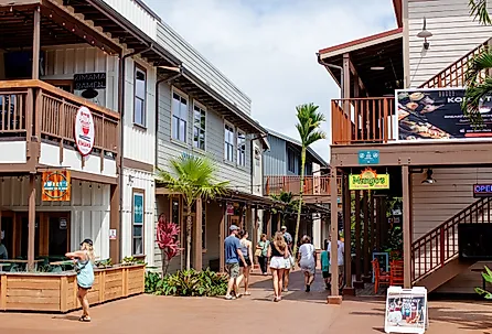 People in downtown Koloa Village, Kauai, Hawaii. Image credit bluestork via Shutterstock 