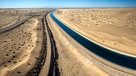 Dramatic aerial view of the all-American canal traveling through the Buttercup sand dunes in imperial county California.
