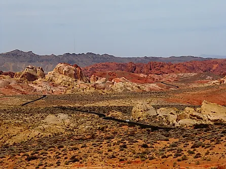 Road running through the otherworldly multicoloured, barren landscape of the Valley of Fire State Park, Nevada. 