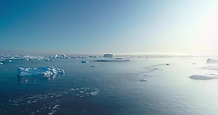 Sunny Antarctica ocean aerial landscape, showcasing ice actively melting. 