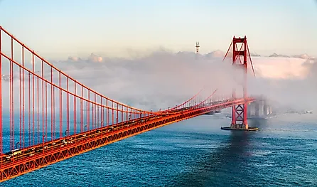 Golden Gate Bridge shrouded in fog overlooking the bay in San Francisco