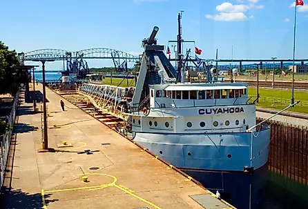 Great Lakes freighters passes through the Soo Locks at Sault Ste Marie Michigan connecting Lake Superior with Lake Huron. Image credit Dennis MacDonald via Shutterstock