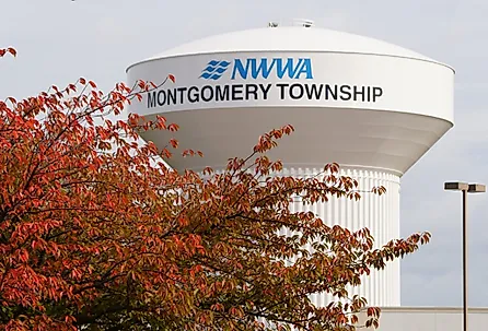 The water tower of NWWA Montgomery Township with the fall foliage, Pennsylvania. Image credit Khairil Azhar Junos via Shutterstock