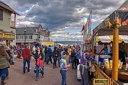 People enjoying the Annual Applefest in Bayfield, Wisconsin, USA, with colorful stalls and a festive atmosphere. Editorial credit: Jacob Boomsma / Shutterstock.com