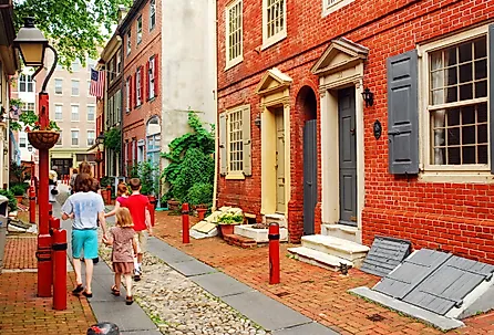 A family strolls down Elfreth's Alley, Philadelphia, the oldest street in continuous use in the United States.