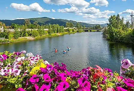Kayakers enjoy a summer day on Sand Creek River and Lake Pend Oreille in the downtown area of Sandpoint, Idaho. Image Credits: Kirk Fisher via Shutterstock