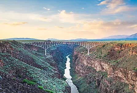 Taos, New Mexico, USA at Rio Grande Gorge Bridge over the Rio Grande at dusk. Image credit Sean Pavone via Shutterstock.