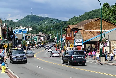 Busy street in summer time with tourist and car in Gatlinburg, Tennessee. Image credit Miro Vrlik Photography via Shutterstock