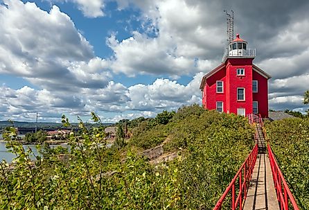 Marquette Harbor Lighthouse, Michigan with catwalk on a sunny summer day.