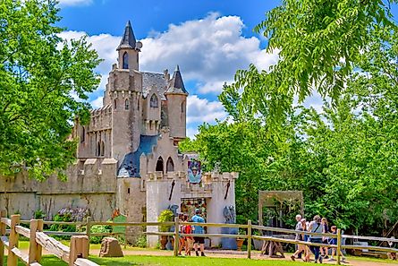 People visiting the enchanting fairytale castle in Waxahachie during the Scarborough Renaissance Festival. Editorial credit: Grossinger / Shutterstock.com