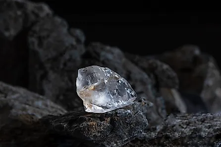 Natural rough diamonds on a pile of rocs close up photography.