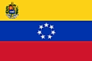 Yellow, blue, and red horizontal flag with official seal in canton and seven white stars forming a circle on blue