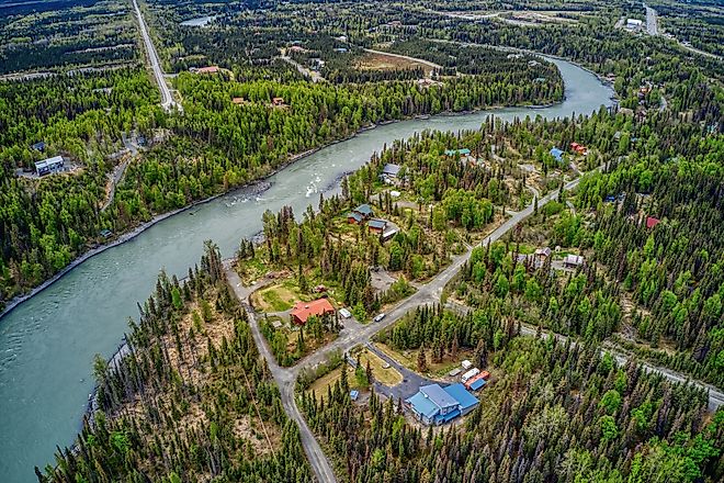 The turquoise waters of the Kenai River flowing along the Chugach Mountains.