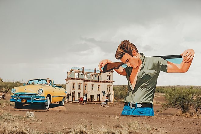 Enormous cutouts from the movie "Giant", starring Rock Hudson and Elizabeth Taylor, created by artist John Cerney in 2018, outside Marfa, Texas.
