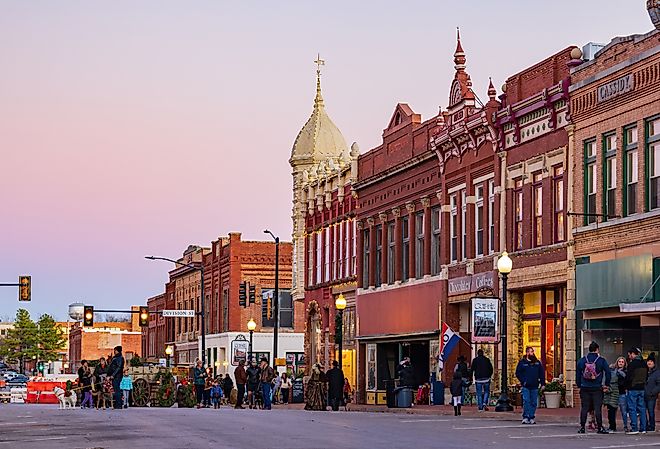 Night view of downtown street in Guthrie, Oklahoma. Image credit Kit Leong via Shutterstock