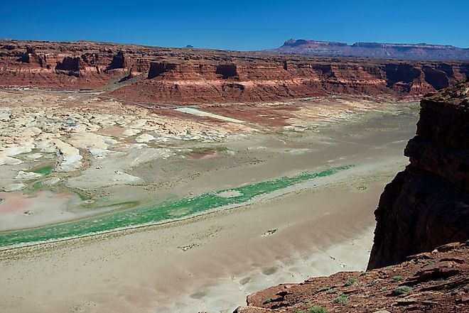 The Colorado River and the dried up arm of Lake Powell at Hite, Utah