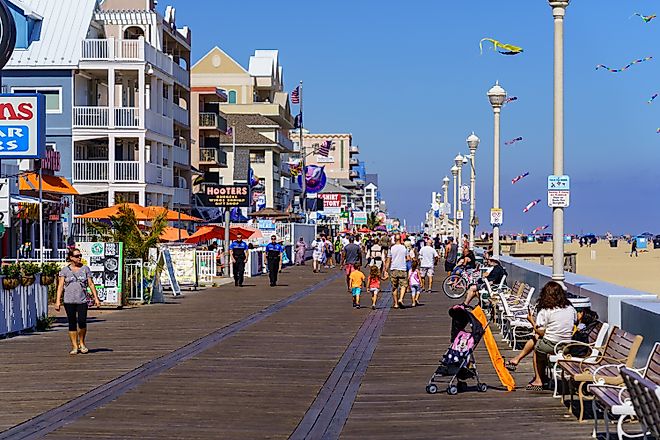 People walk on the Ocean City Boardwalk in Ocean City, Maryland. Image credit: George Sheldon / Shutterstock.com.