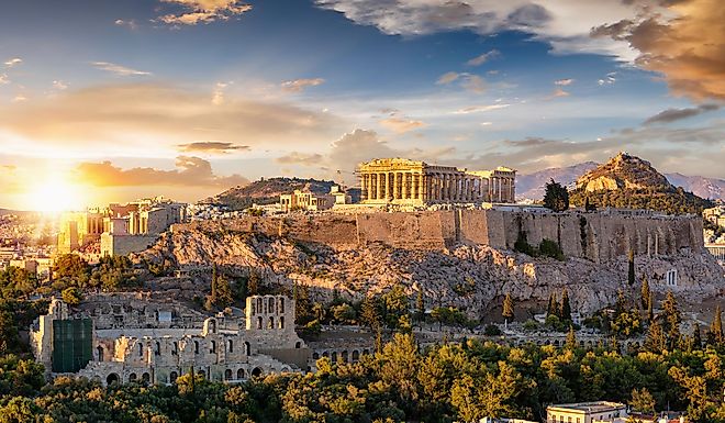 The Acropolis of Athens, Greece, with the Parthenon Temple on top of the hill during a summer sunset.
