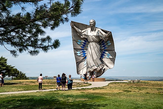 People gather around the Dignity Statue in Chamberlain, South Dakota.