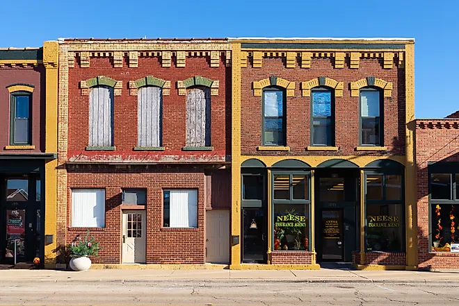Downtown storefronts in Fulton, Illinois, USA, on a beautiful sunny afternoon. Editorial credit: Eddie J. Rodriquez vuia Shutterstock.com