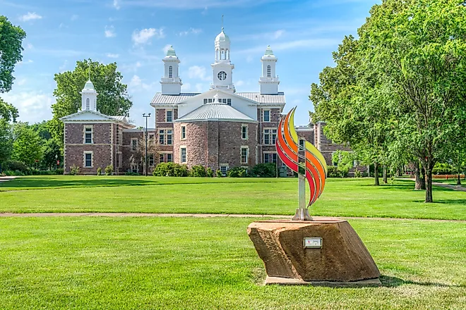 Spectrum Sculpture and Old Main on the campus of the University of South Dakota. (Editorial credit: Ken Wolter / Shutterstock.com)