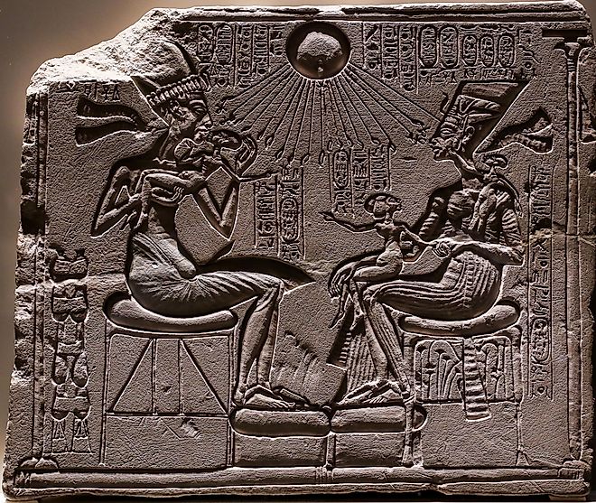 Relief depicting Akhenaten and Nefertiti with three of their daughters under the rays of Aten.