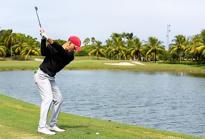 Golfer teeing off a the Trump National Doral. Editorial credit: YES Market Media / Shutterstock.com