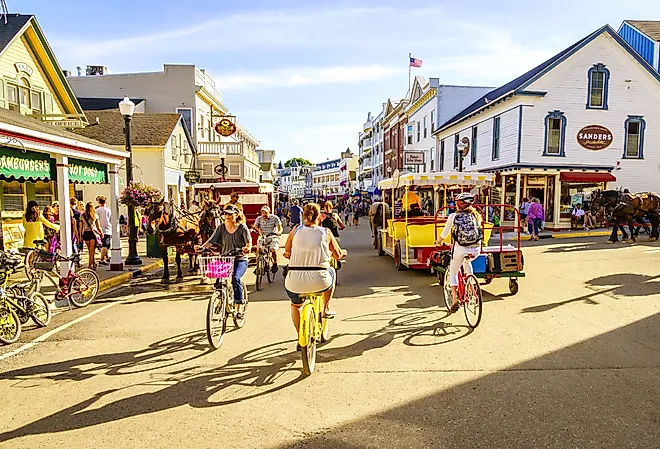 Vacationers take on Market Street in Mackinac Island, Michigan. Image credit Alexey Stiop via Shutterstock