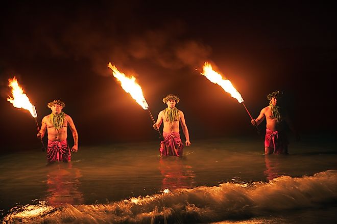 Three Maui Men Juggling Fire in Hawaii