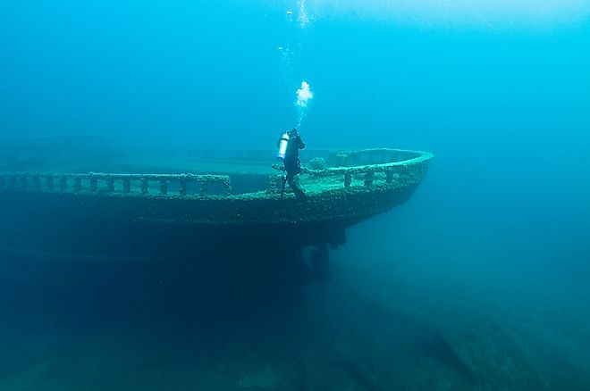 A diver inspects the bow of the wreck of the steel bulk freighter Grecian, where it rests in Lake Huron's Thunder Bay National Marine Sanctuary.