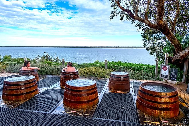 Individual barrel spas at Metung Hot Springs, a natural spa resort in the Gippsland Lakes of Metung, Victoria. Image credit: Paul Harding 00 / Shutterstock.com.