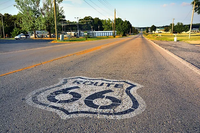 U.S. Route 66 highway, with sign on asphalt on Missouri. 