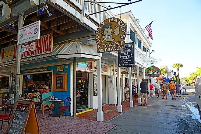 Local businesses in downtown Key West, Florida. Editorial credit: Dennis MacDonald / Shutterstock.com.