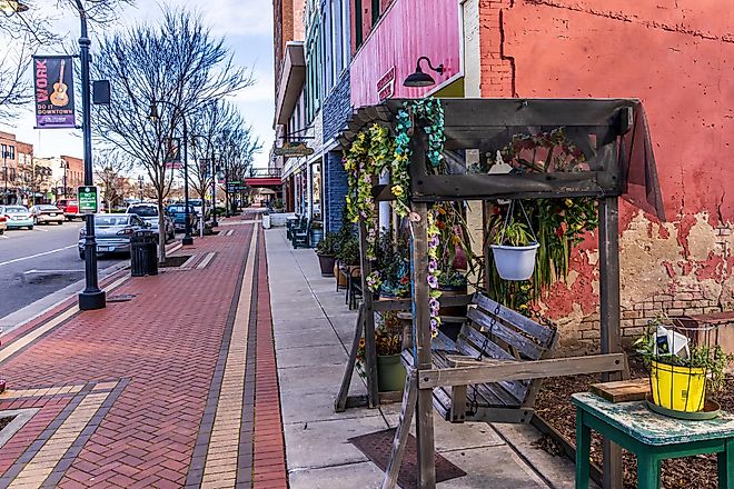 Goldsboro, North Carolina, USA: A view of downtown Goldsboro from a swing in front of a Thai restaurant. Editorial credit: Wileydoc / Shutterstock.com