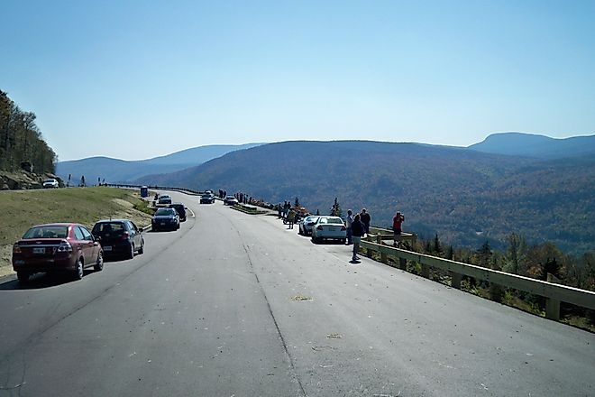 Tourists gather at the Height of Land Lookout to enjoy the view of Maine's natural beauty, Rangeley Lakes Scenic Byway