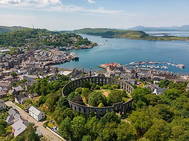 Aerial view of the Mccaig's Tower and Battery Hill in Oban, Scotland.